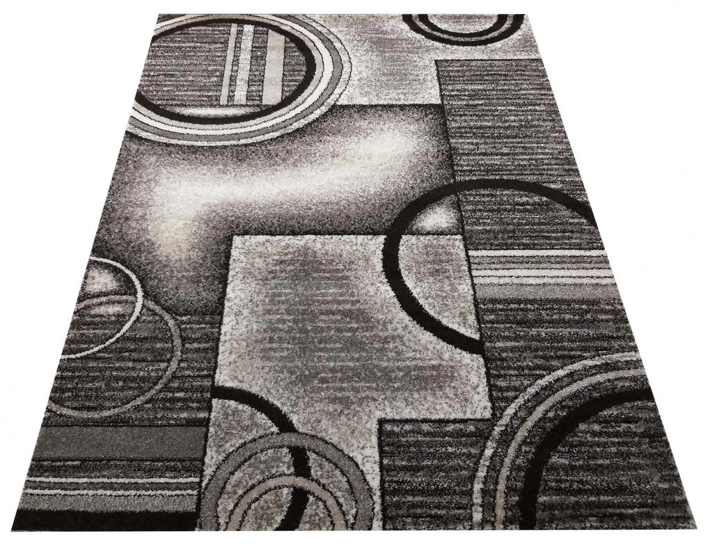 Originálny sivo hnedý koberec s motívom abstraktných kruhov