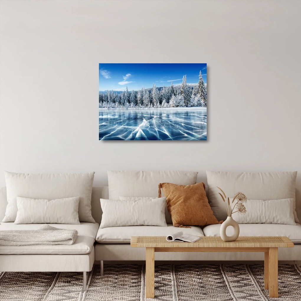Sklenený obraz zamrznutého jazera a zasnežených stromov (70x50 cm)
