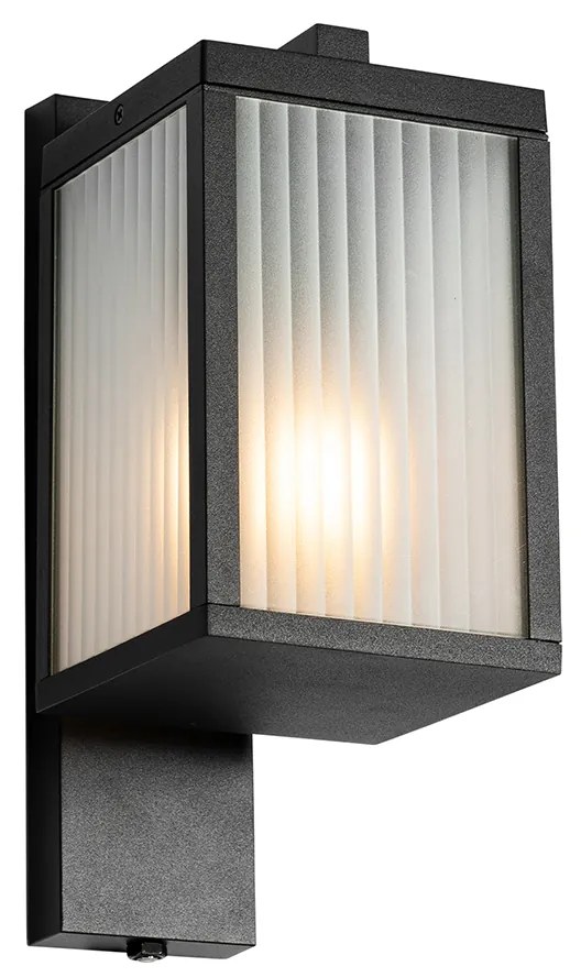 Vonkajšia nástenná lampa čierna s rebrovaným sklom a senzorom súmraku - Charlois