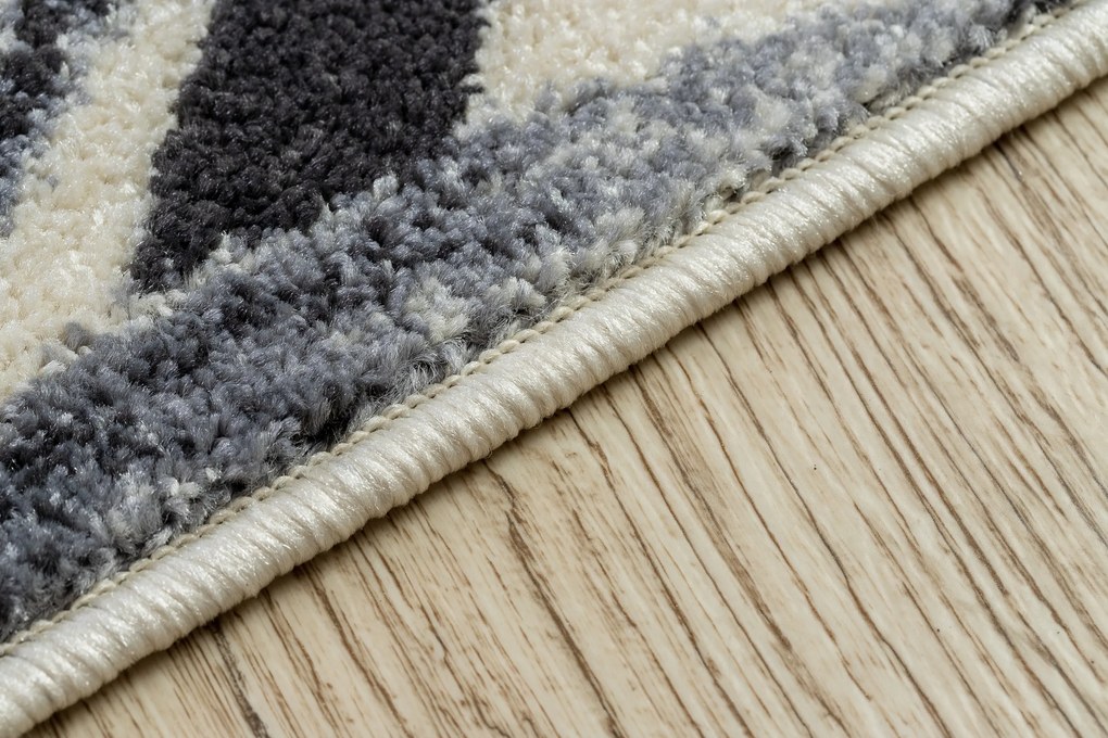 Koberec HEOS 78540 krémovo / modrý LISTY DŽUNGLE