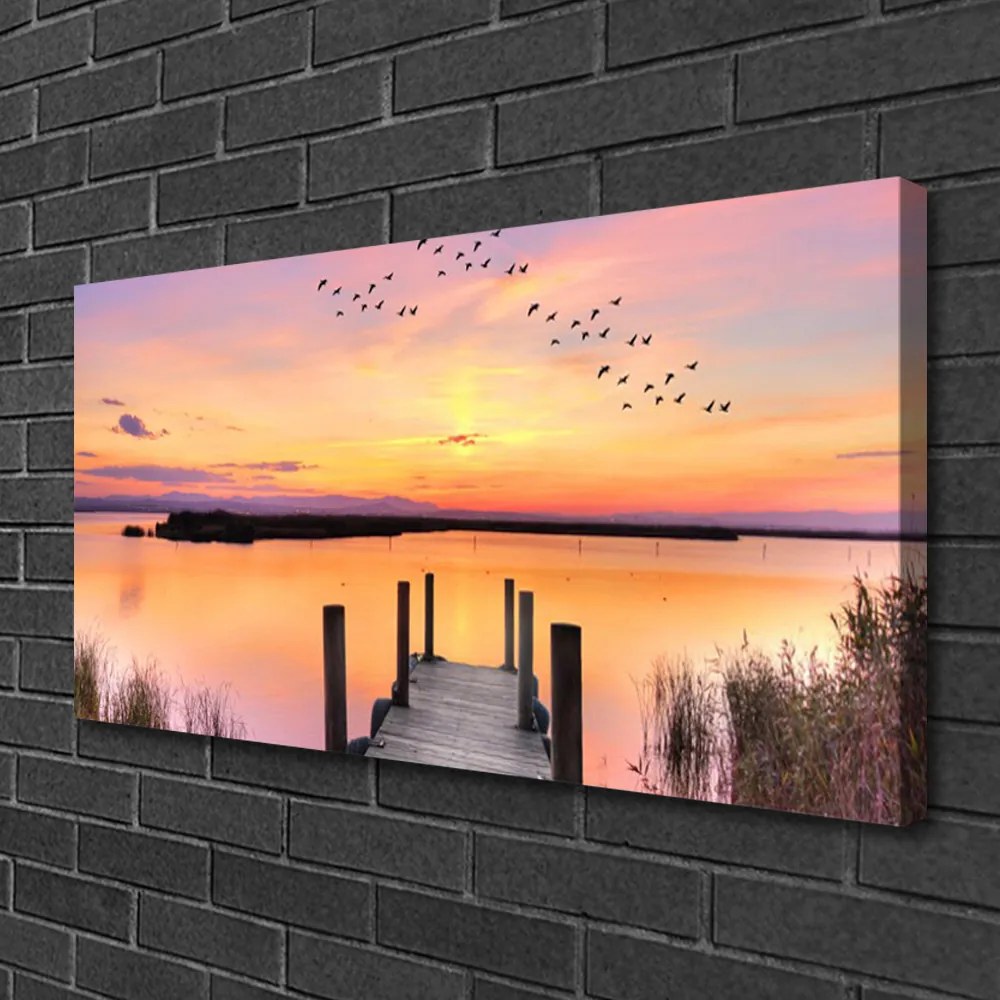 Obraz Canvas Mólo západ slnka jazero 140x70 cm