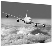 Obraz - Lietadlo v oblakoch, čiernobiele (70x50 cm)