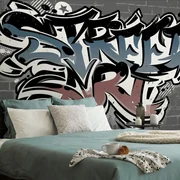 Tapeta s tehlovou imitáciou a nápisom Street Art
