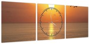 Obraz - Západ slnka nad oceánom (s hodinami) (90x30 cm)