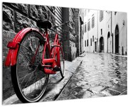 Obraz červeného kolesa na dláždenej ulici (90x60 cm)