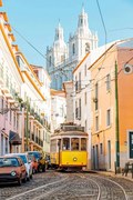 Fotografia Yellow tram on the narrow street, Alexander Spatari