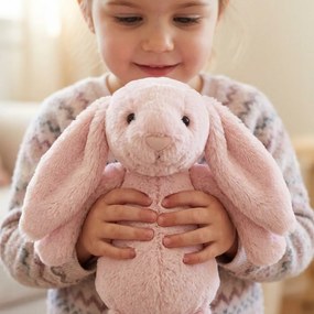 Roztomilý ružový plyšový zajačik