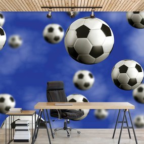 Fototapeta - Futbalové lopty na modrom pozadí (152,5x104 cm)