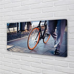 Obraz canvas Mesto na bicykli noha 120x60 cm