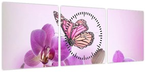Obraz - Motýľ na kvetoch orchidey, lila (s hodinami) (90x30 cm)