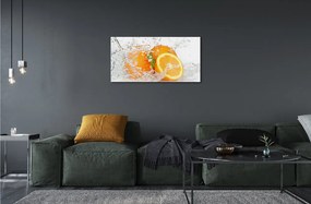 Obraz na skle Pomaranče vo vode 100x50 cm