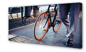 Obraz canvas Mesto na bicykli noha 125x50 cm