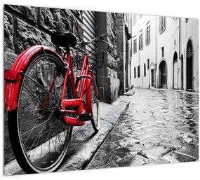 Obraz červeného kolesa na dláždenej ulici (70x50 cm)