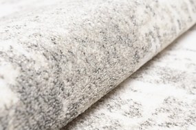 Dizajnový koberec s abstraktným vzorom v krémovej farbe Šírka: 80 cm | Dĺžka: 150 cm