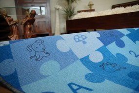 Detský guľatý koberec PUZZLE modrý
