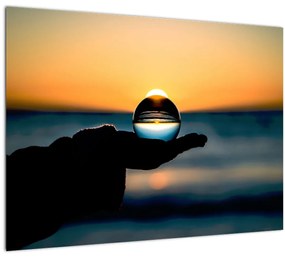 Sklenený obraz sklenenej gule v dlani (70x50 cm)