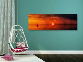 Obraz loďka a nádherný západ slnka