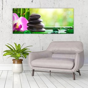 Obraz masážnych kameňov a orchidey na vode (120x50 cm)