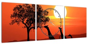 Obraz žirafy pri západe slnka (s hodinami) (90x30 cm)