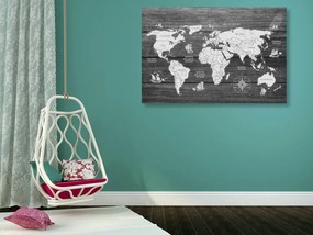 Obraz na korku čiernobiela mapa sveta s dreveným pozadím