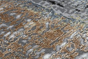 Moderný koberec DE LUXE 633 Abstrakcia - Štrukturálny krém / zlatý