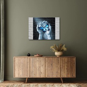 Obraz modrého motýľa na stene (70x50 cm)