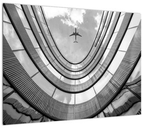 Sklenený obraz - Lietadlo nad budovou (70x50 cm)