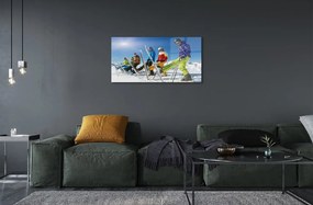 Obraz na skle Lyžiari zimné hory 100x50 cm