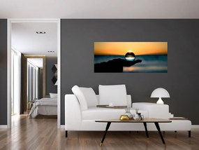 Obraz sklenenej gule v dlani (120x50 cm)