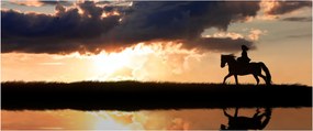 Obraz - Jazdec na koni pri západe slnka (120x50 cm)