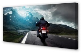 Obraz canvas Motocykla horskej ceste muž neba 125x50 cm