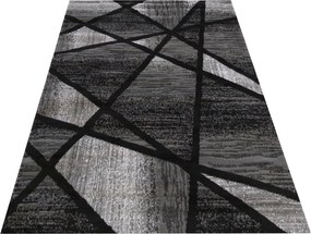 Moderný sivo čierny koberec s abstraktným vzorom