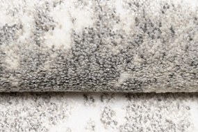 Dizajnový koberec s abstraktným vzorom v krémovej farbe Šírka: 80 cm | Dĺžka: 150 cm