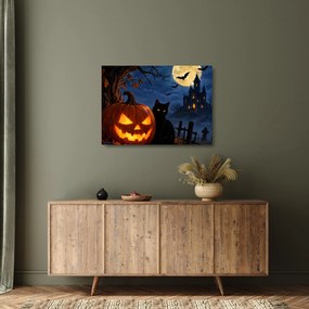 Sklenený obraz - Čierna mačka pri svietiacej tekvici na Halloween (70x50 cm)