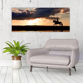 Obraz - Jazdec na koni pri západe slnka (120x50 cm)