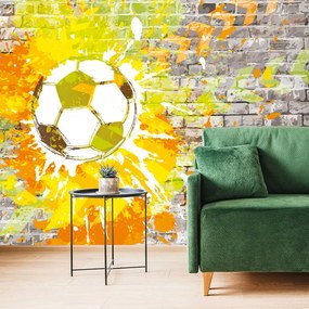 Samolepiaca tapeta futbalová lopta na tehlovej stene