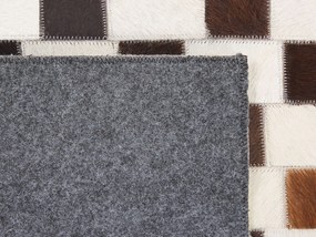 Kožený koberec 140 x 200 cm béžová/hnedá KAYABEY Beliani