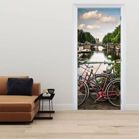 Fototapeta na dvere - Kolesá v meste (95x205cm)