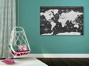Obraz na korku historická mapa sveta na drevenom pozadí v čiernobielom prevedení