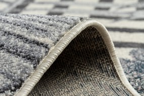 Koberec HEOS 78540  krémovo / modrý LISTY DŽUNGLE