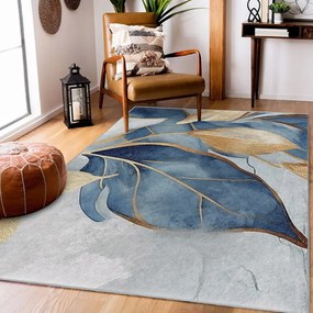 Prateľný koberec v modrej a zlatej farbe 160x230 cm Golden Leaves – Mila Home