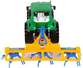 Lean Toys Zelený traktor s hrabľami na seno – trecí pohon