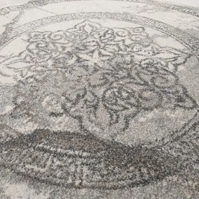 Luxusný sivý oválny koberec s originálnym vzorom