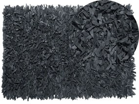 Kožený koberec 140 x 200 cm čierny MUT Beliani