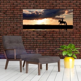 Obraz - Jazdec na koni pri západe slnka (120x50 cm)