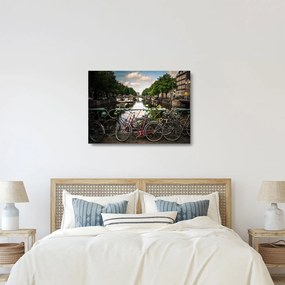 Sklenený obraz bicykla v meste (70x50 cm)