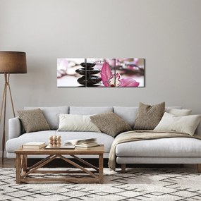 Obraz masážnych kameňov a orchidey na vode (s hodinami) (90x30 cm)
