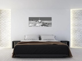 Obraz - Lietadlo v oblakoch, čiernobiele (120x50 cm)