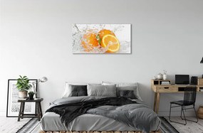 Obraz na skle Pomaranče vo vode 140x70 cm