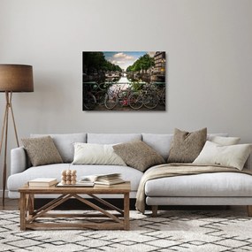 Sklenený obraz bicykla v meste (70x50 cm)